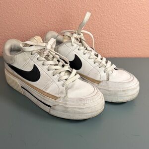 Nike White Sneakers with Black Swoosh and Tan Accent